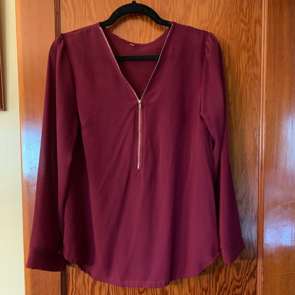 Maroon zip front, long sleeve blouse